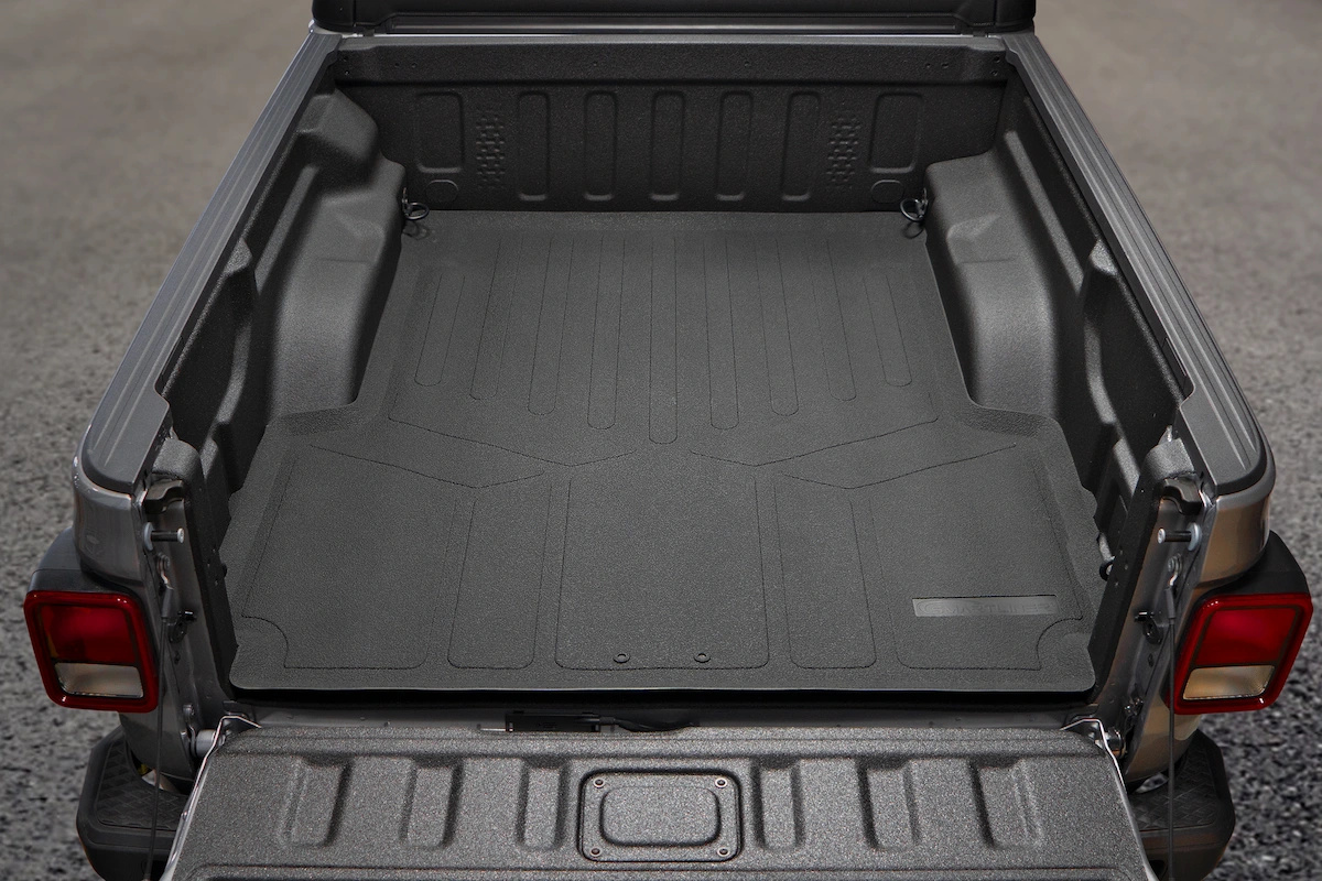 Image of a truck bed with a custom fit mat